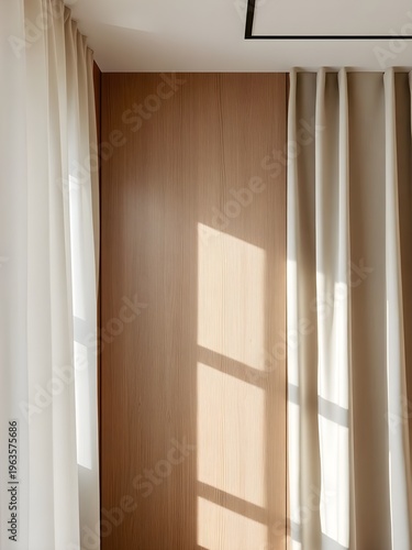 A serene interior scene with natural light shining through sheer curtains