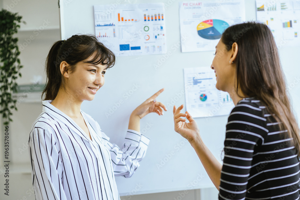 Obraz premium Business team meeting discussion collaboration presenting data analysis corporate teamwork diverse professionals planning strategy office communication partnership