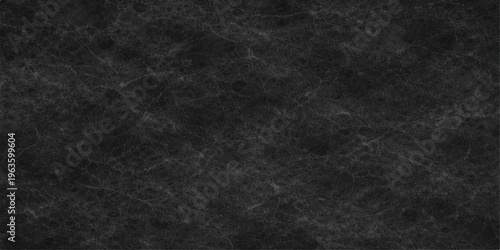 A high resolution close up of a dark grey marble texture with natural veins and smooth surface