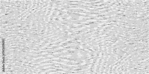 Abstract grayscale texture with scattered dark markings and light variations