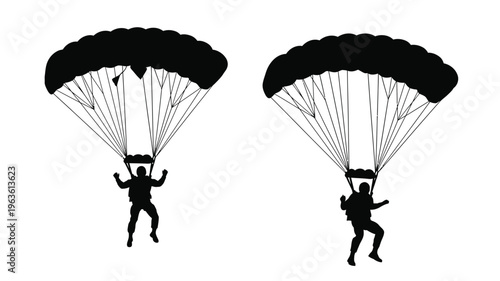 Two skydivers descending with open parachutes a striking silhouette