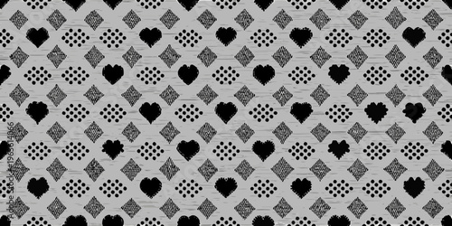 Seamless grayscale pattern featuring hearts and diamond shapes