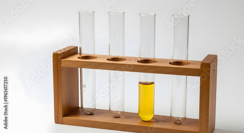 Wooden test tube holder with yellow liquid