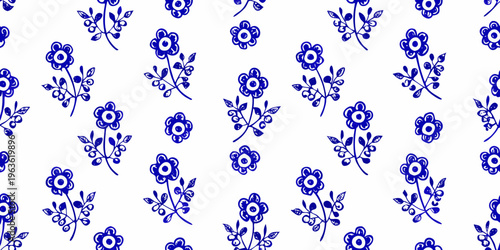 Blue floral pattern featuring delicate blossoms and curving stems on white