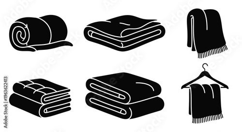 Black and white illustration of folded towels and a blanket silhouette