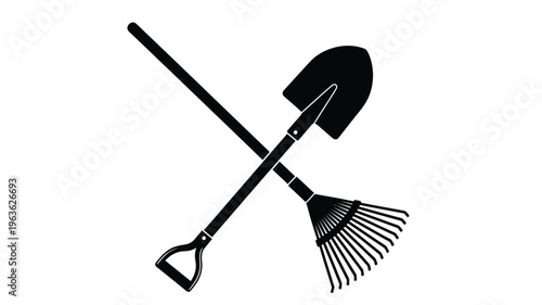Crossed garden tools a shovel and rake in black silhouette