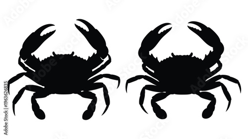 Two black crab shapes facing each other a striking silhouette