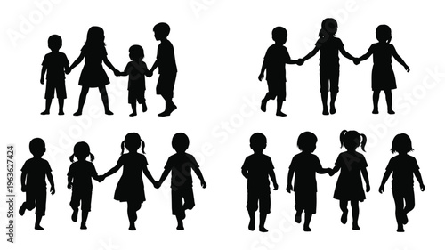 Children holding hands in a playful group a dark silhouette