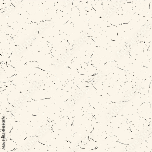 Abstract background featuring a minimalist pattern of small black marks on a stark white surface