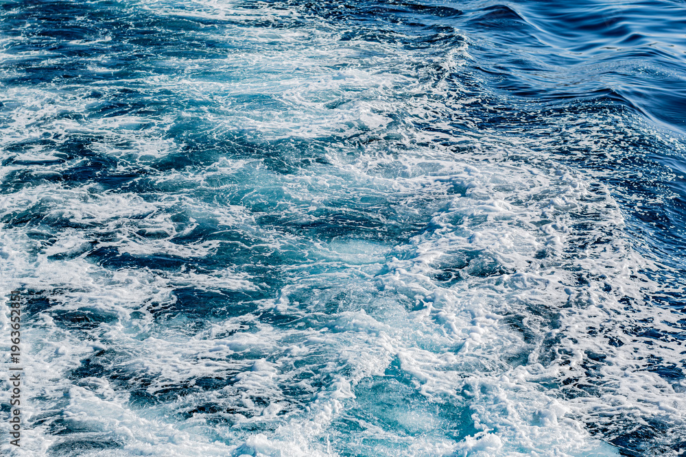 Fototapeta premium Foamy blue ocean wake texture