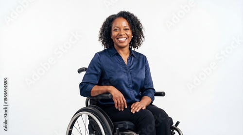 Confident smiling Black businesswoman in wheelchair on white background for inclusive leadership concept