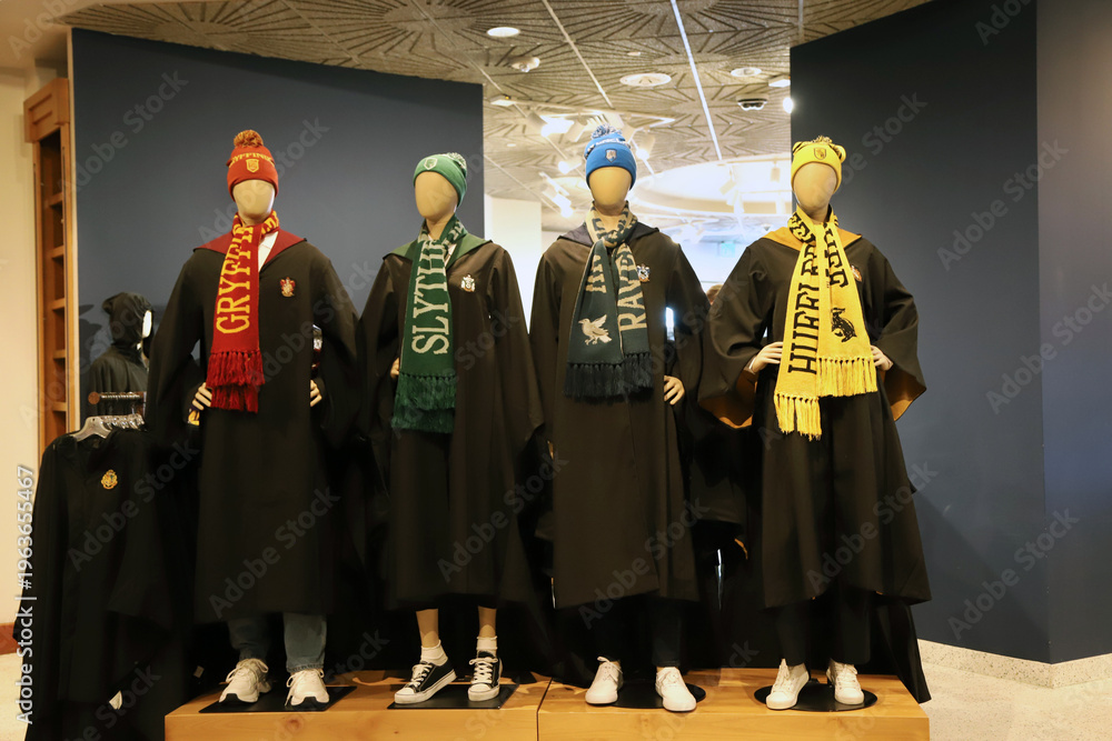 Naklejka premium Mannequins wearing robes and scarves representing the four houses of Hogwarts school