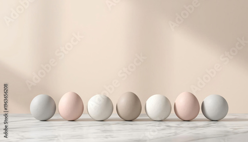 Earth-toned eggs harmoniously lined up on a neutral background.