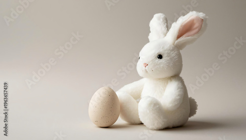 white rabbit with a red bow