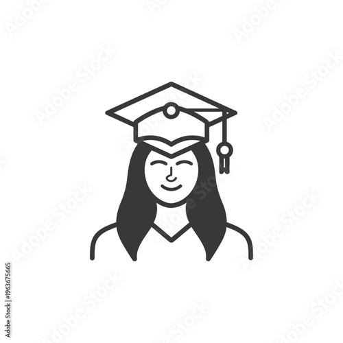 A graduating student wearing a cap smiles at the camera