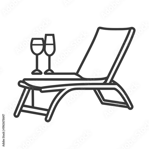 A relaxing lounge chair with two elegant wine glasses