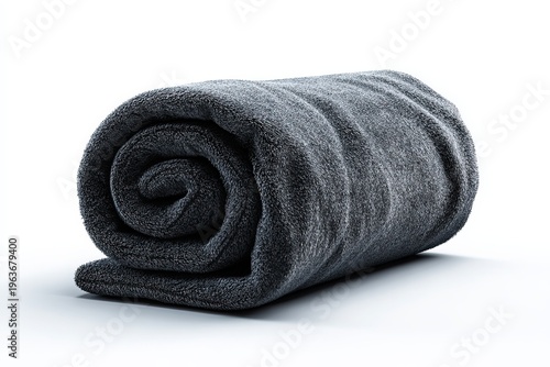 A tightly rolled, soft, dark grey blanket. Its texture suggests warmth and comfort.