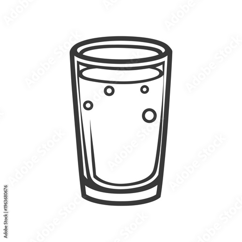 A transparent drinking glass filled with bubbles of liquid