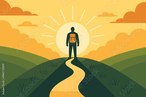 Silhouette of a hiker with a backpack standing on a hilltop at sunrise