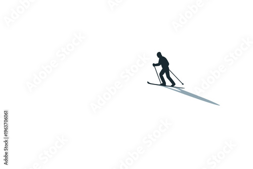 Lone skier silhouette gracefully descends a snowy slope with a long shadow