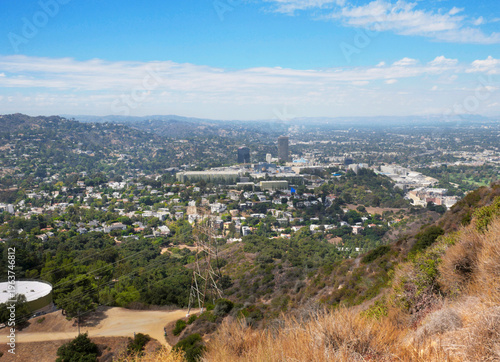 Bild auf Leinwand Skyline of Universal City as seen from the top of Cahuenga Peak at Wisdom Tree d