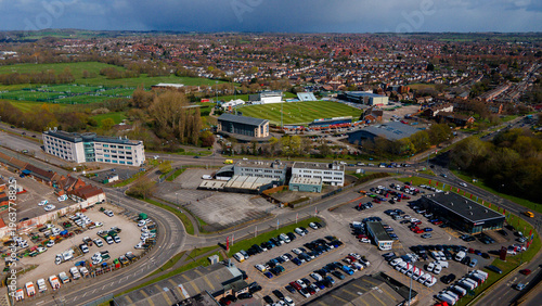 High aerial view of cricket stadium and large parking lots