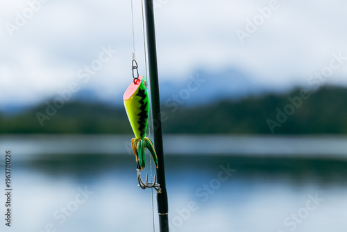 Fotografi Bright fishing lure on rod