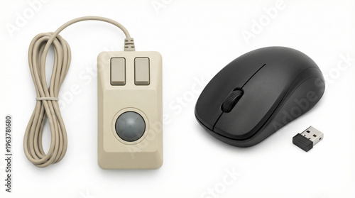 Side by side comparison of a vintage wired trackball mouse and a modern black wireless mouse. Evolution of computer hardware and technology concept. Isolated on white background