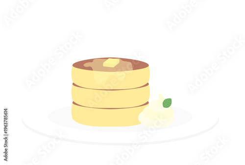 生クリームとバターの添えられた3段のホットケーキ