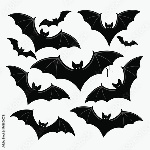 A collection of black bats in various flight poses against white