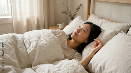 Calm woman lying in bed morning routine for better sleep optimization