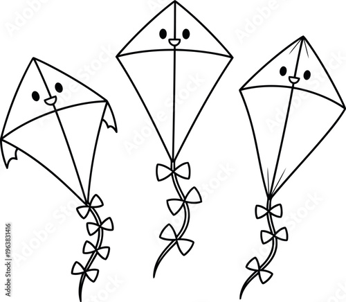 Three smiling kites flying in the sky