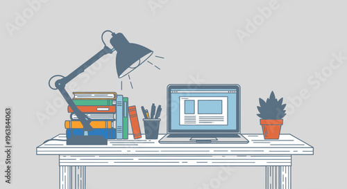 Laptop on a desk with office supplies.