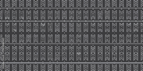 Repeating geometric pattern with stylized zigzag and chevron motifs