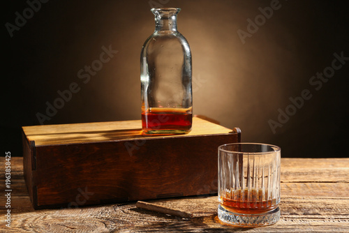 Bottle, glass of whiskey an...