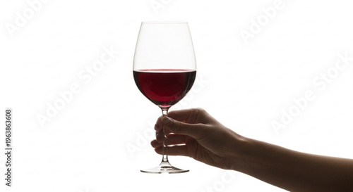Hand holding a glass of red wine isolated on white background perfect for beverage advertising and lifestyle concepts