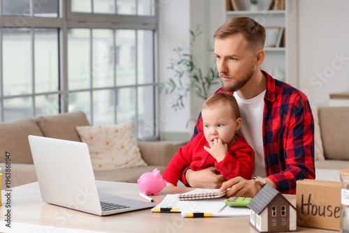 Young man with his baby pla...