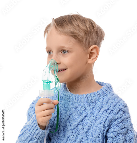 Cute little boy using nebul...