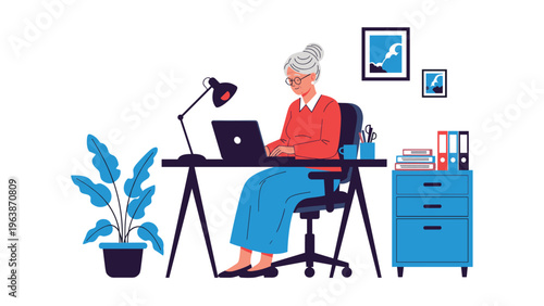 Tech savvy senior woman focuses on her work while using a laptop at a well organized home office desk with various office supplies.