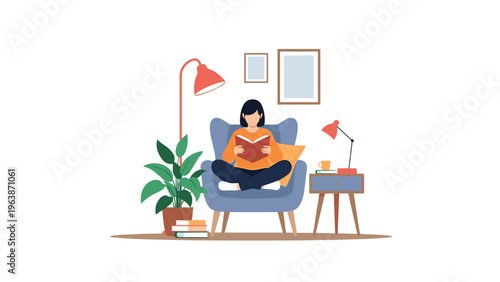 Relaxed woman sitting cross legged in a cozy blue armchair enjoys reading a book in her comfortable modern living room.