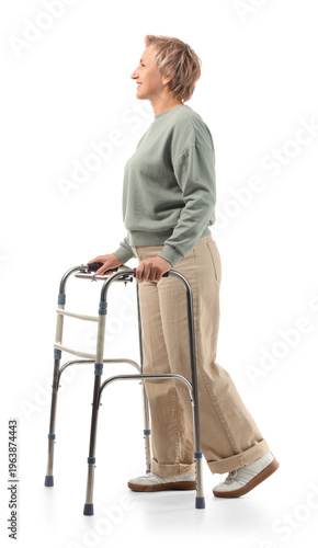 Mature woman using walker o...