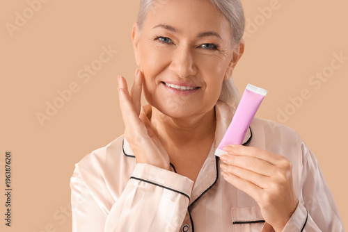 Mature woman in pajamas wit...