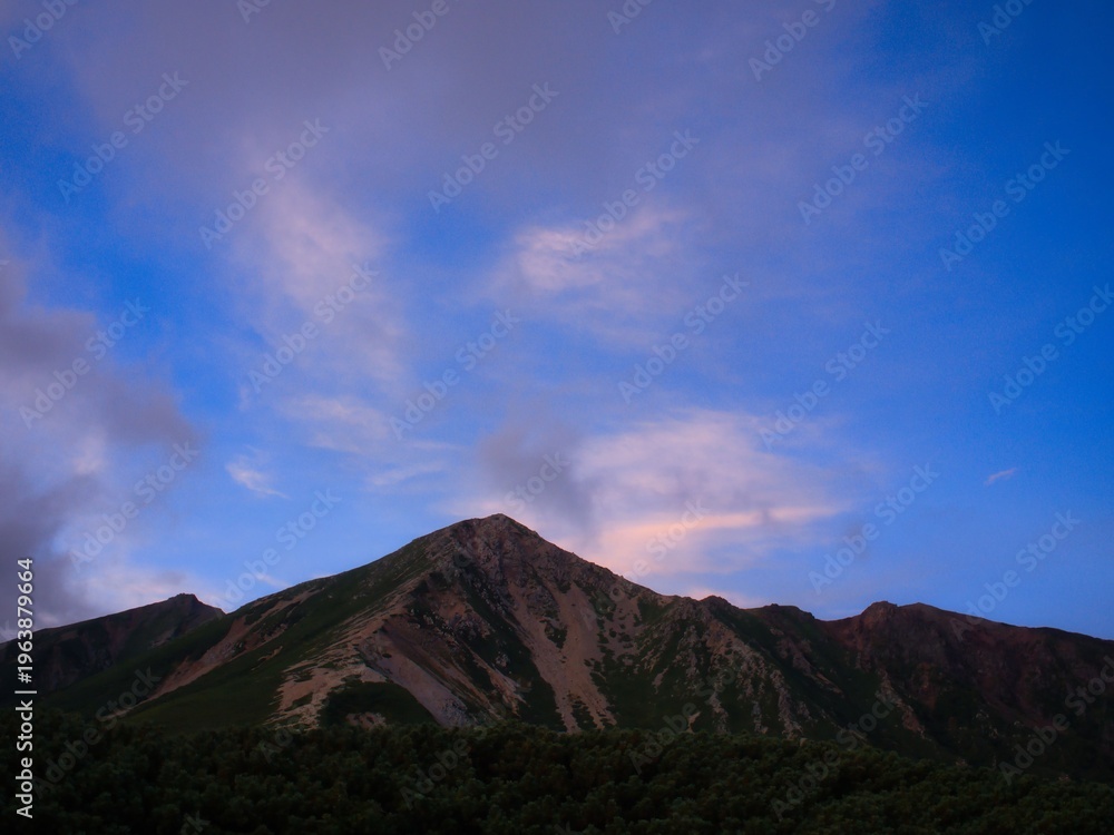 Fototapeta premium Calm Light Over Rugged Mountain