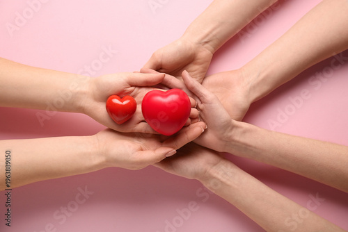 Female hands with hearts on...