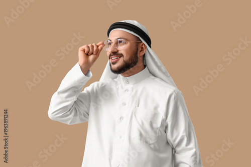 Картината върху платно Arab businessman with eyeglasses on beige background