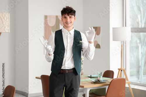 Male waiter with clean glas...