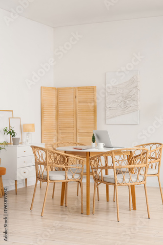Table and wicker chairs nea...