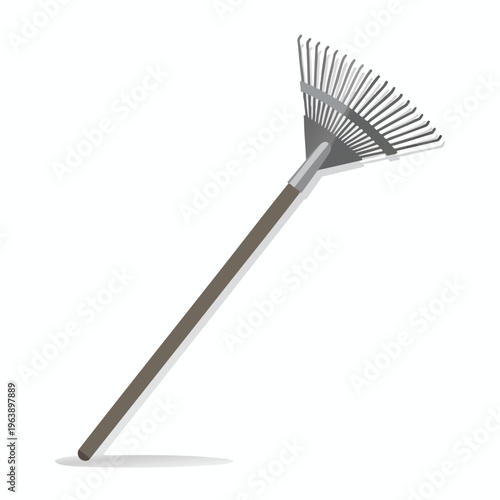 A simple, gray-tined fan rake with a brown handle lies diagonally on a white background