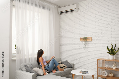 Young woman with air condit...