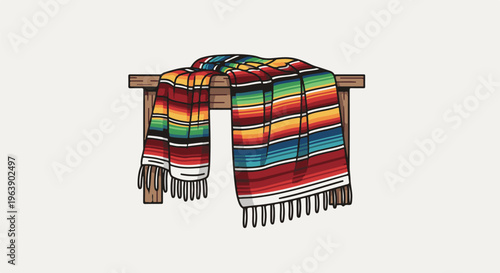 A colorful striped blanket draped over a wooden bench